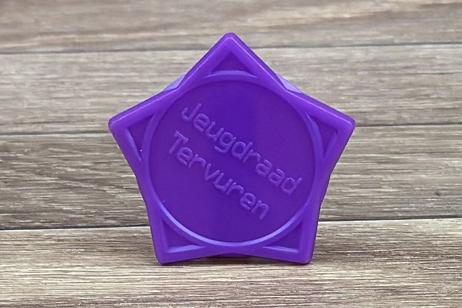 zeshoekige paarse jeton voor Jeugdraad Tervuren